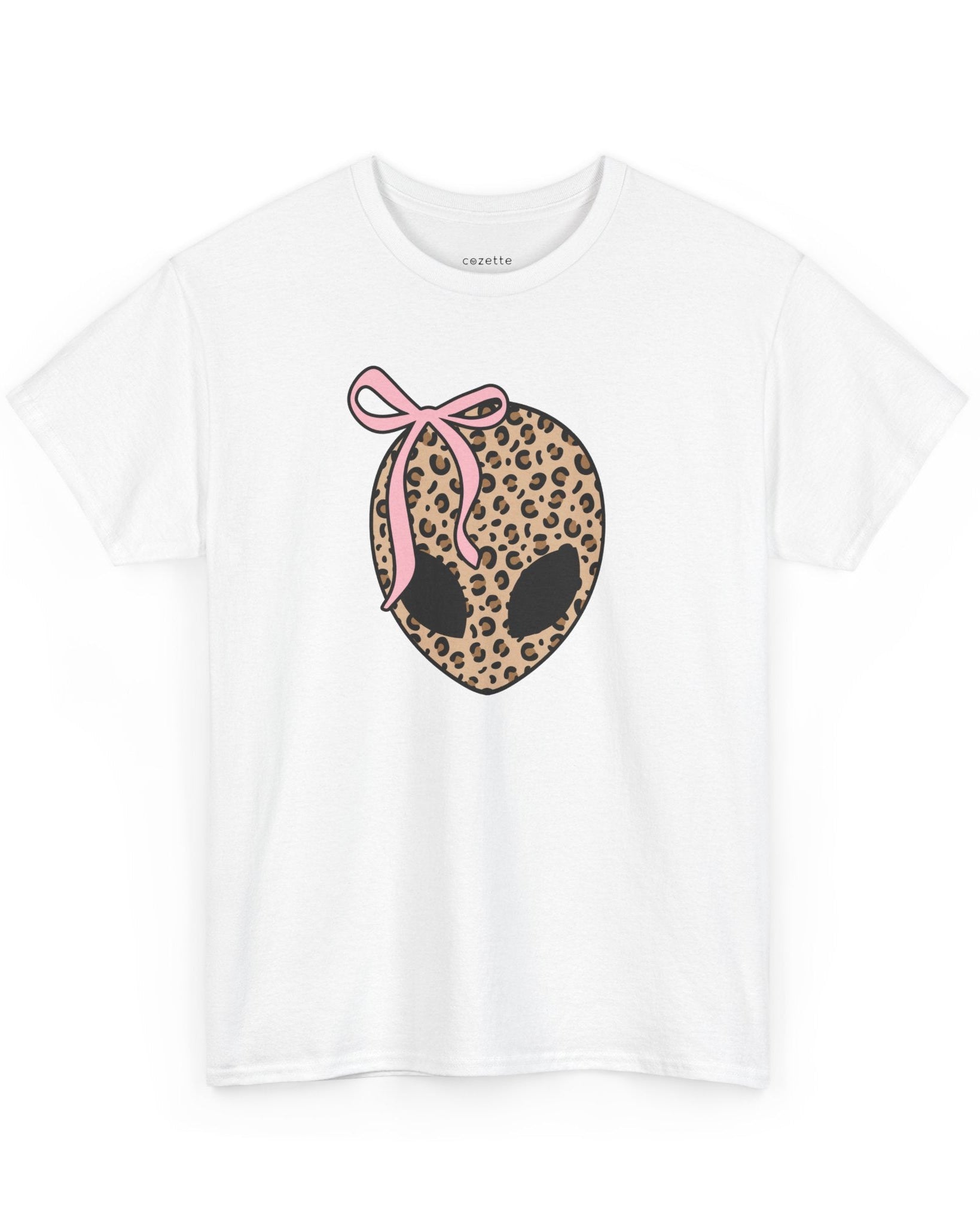 White crew neck t-shirt with a leopard print design of an alien head and a pink ribbon.